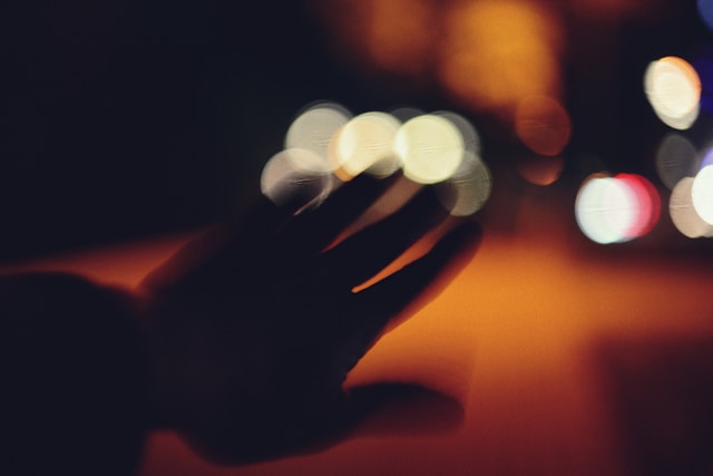 A hand in shadows and light, symbolizing the mysteries of God